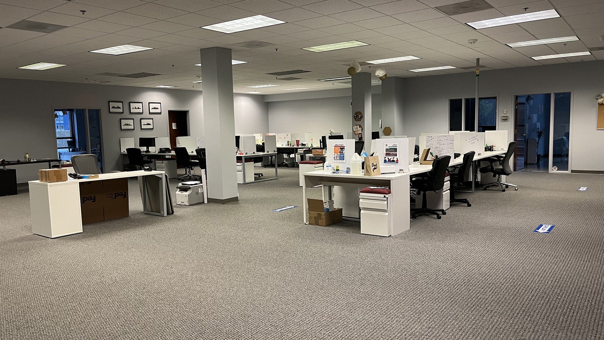 Secondary photo of interior of the suite with open workstations and cubicle furniture