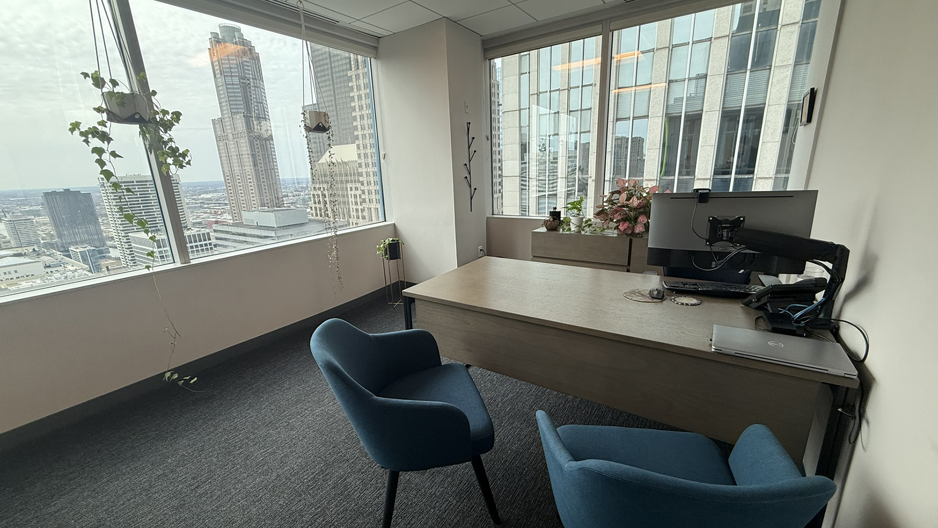 Corner office with desk and tables with great views