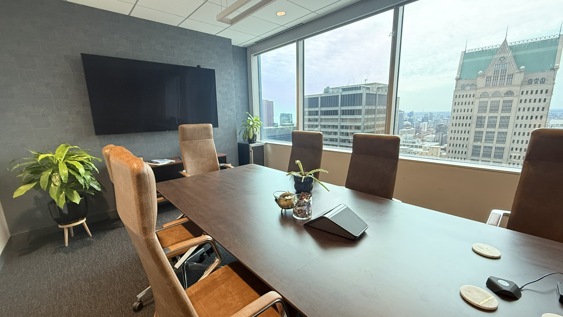 Conference room with chairs and views of the city at 10 S LaSalle in Chicago IL 