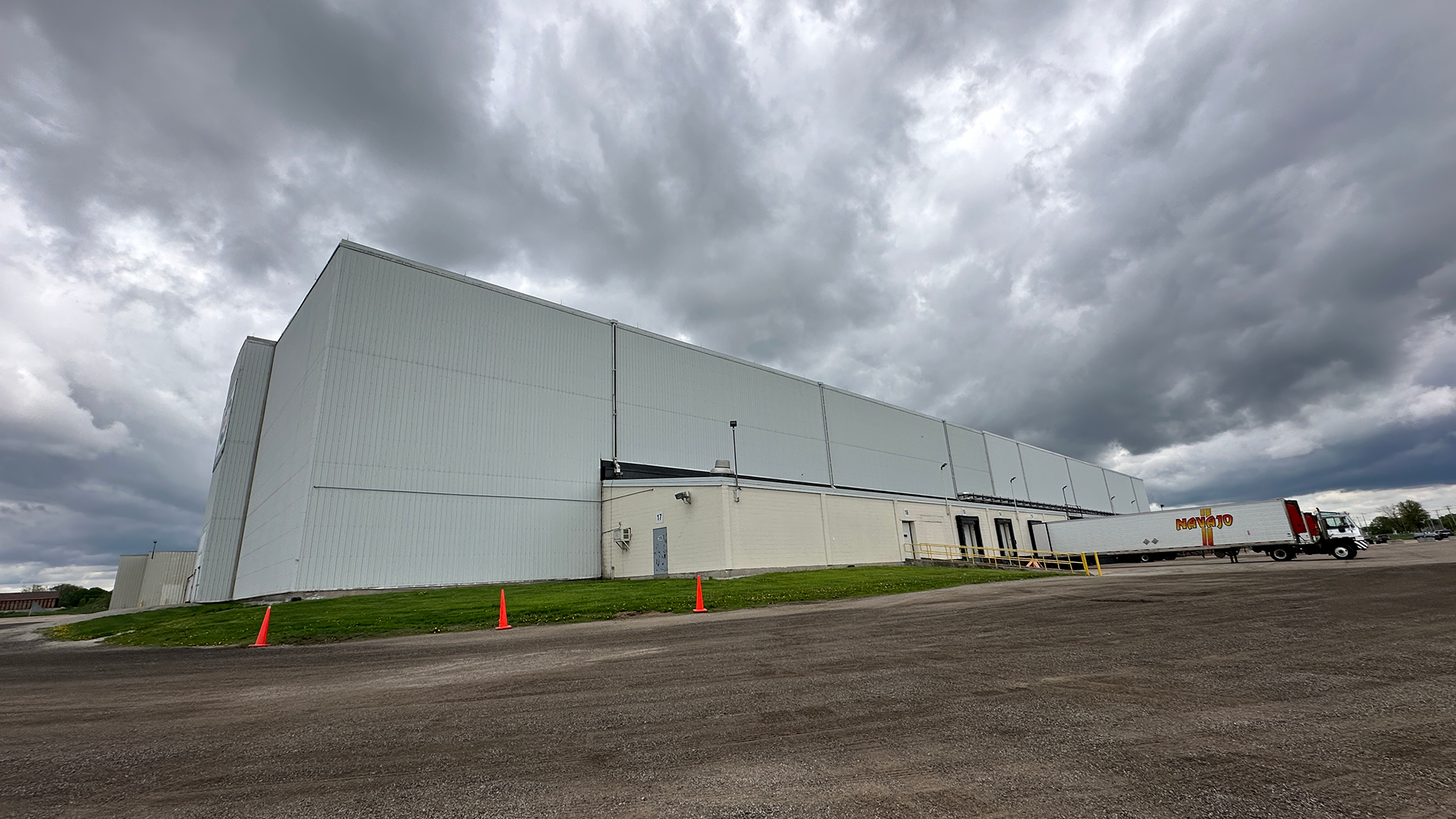 Cloudy exterior side shot of building