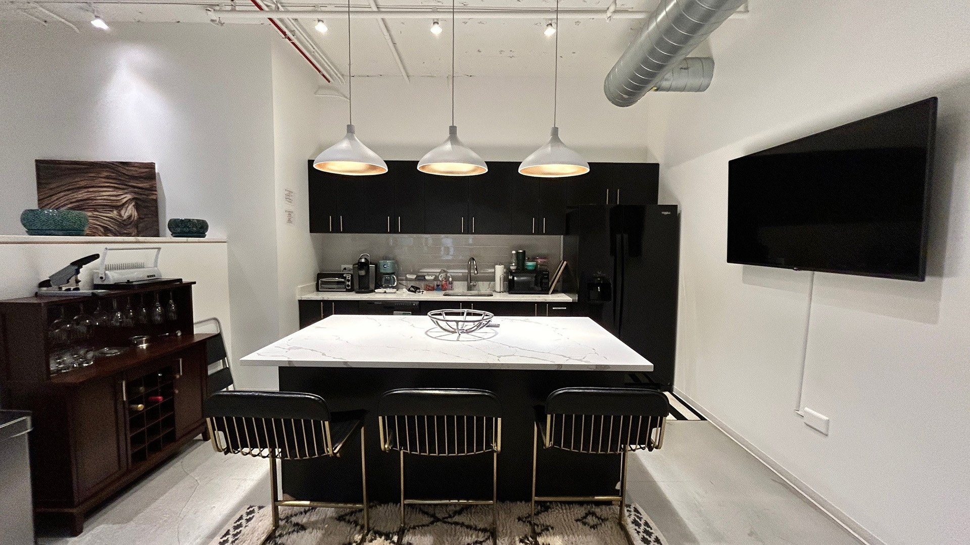 Interior kitchen and meeting area inside of 125 S Clark in Chicago, IL