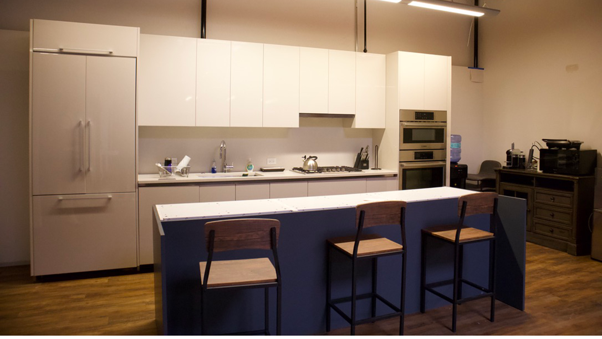 kitchen area at 1455 w hubbard with island and fridge