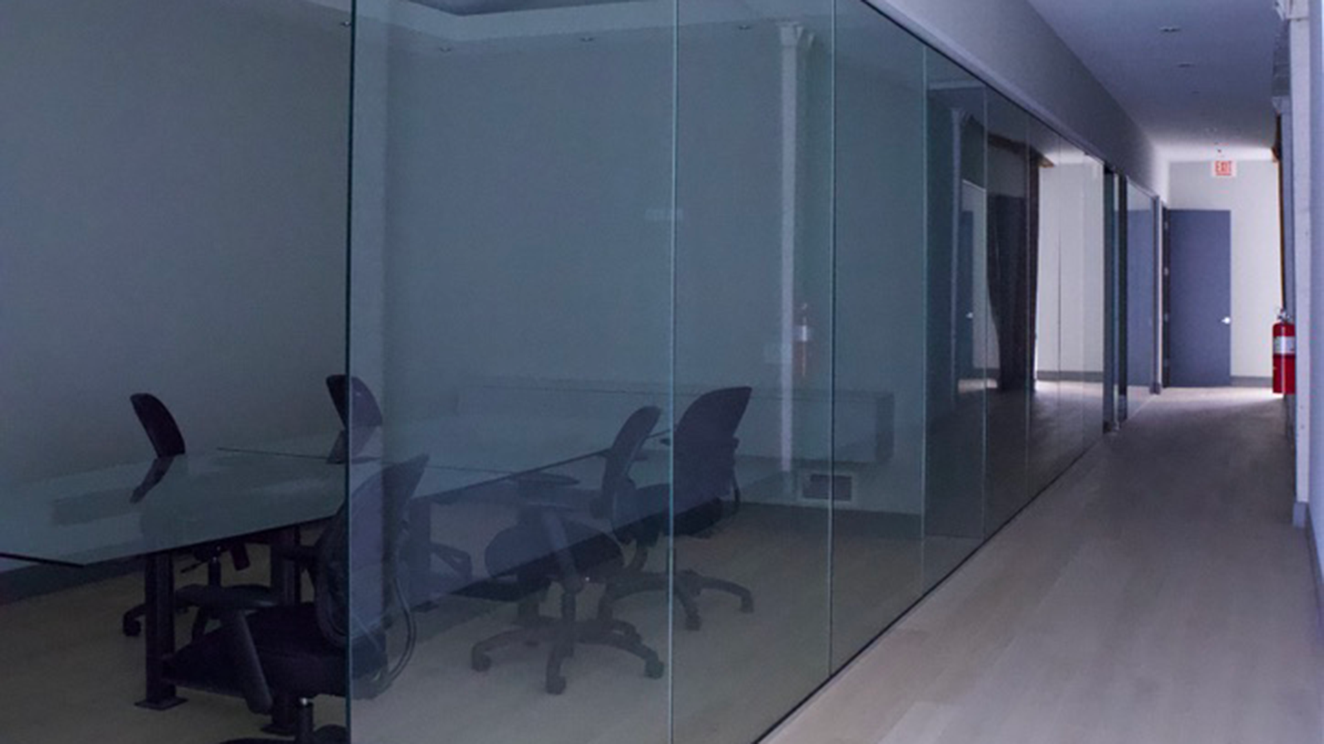 conference room with large table and glass wall at 1455 w hubbard