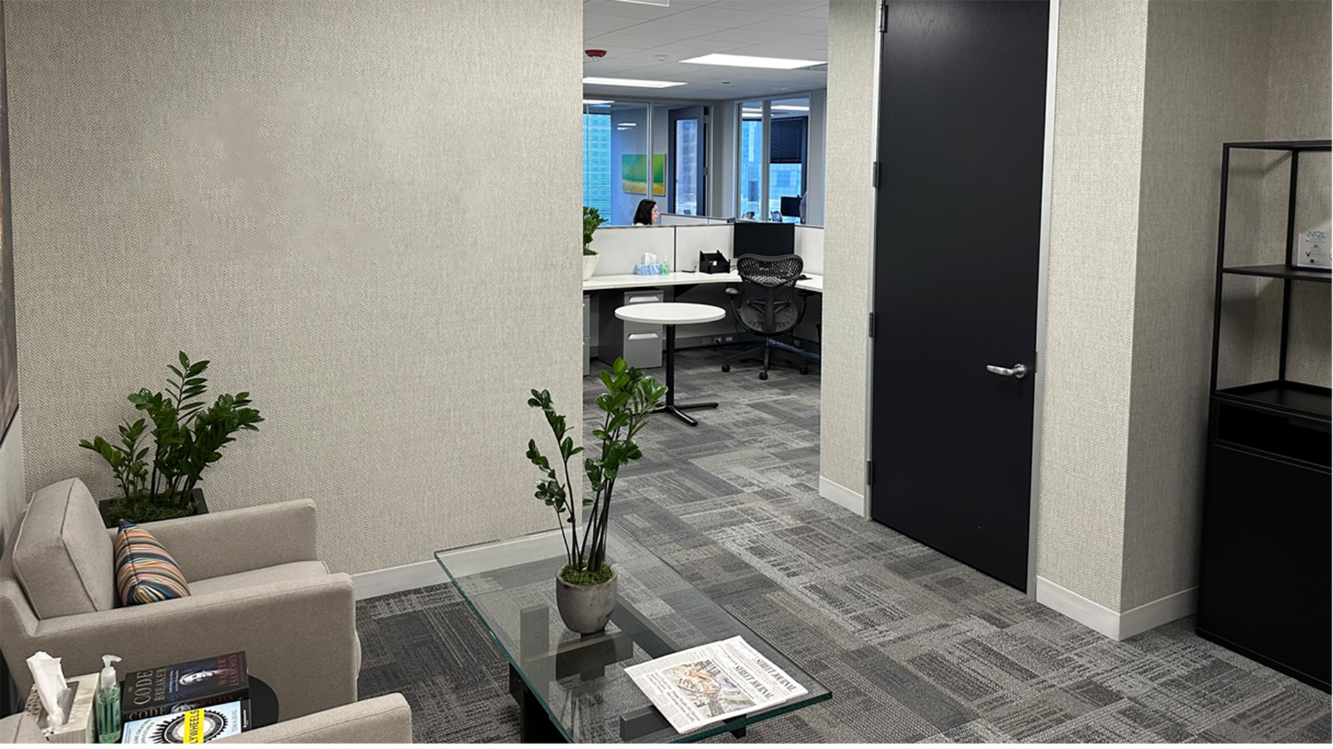 Interior reception area with chairs and plants at the entrance of an office in 150 n Wacker Dr