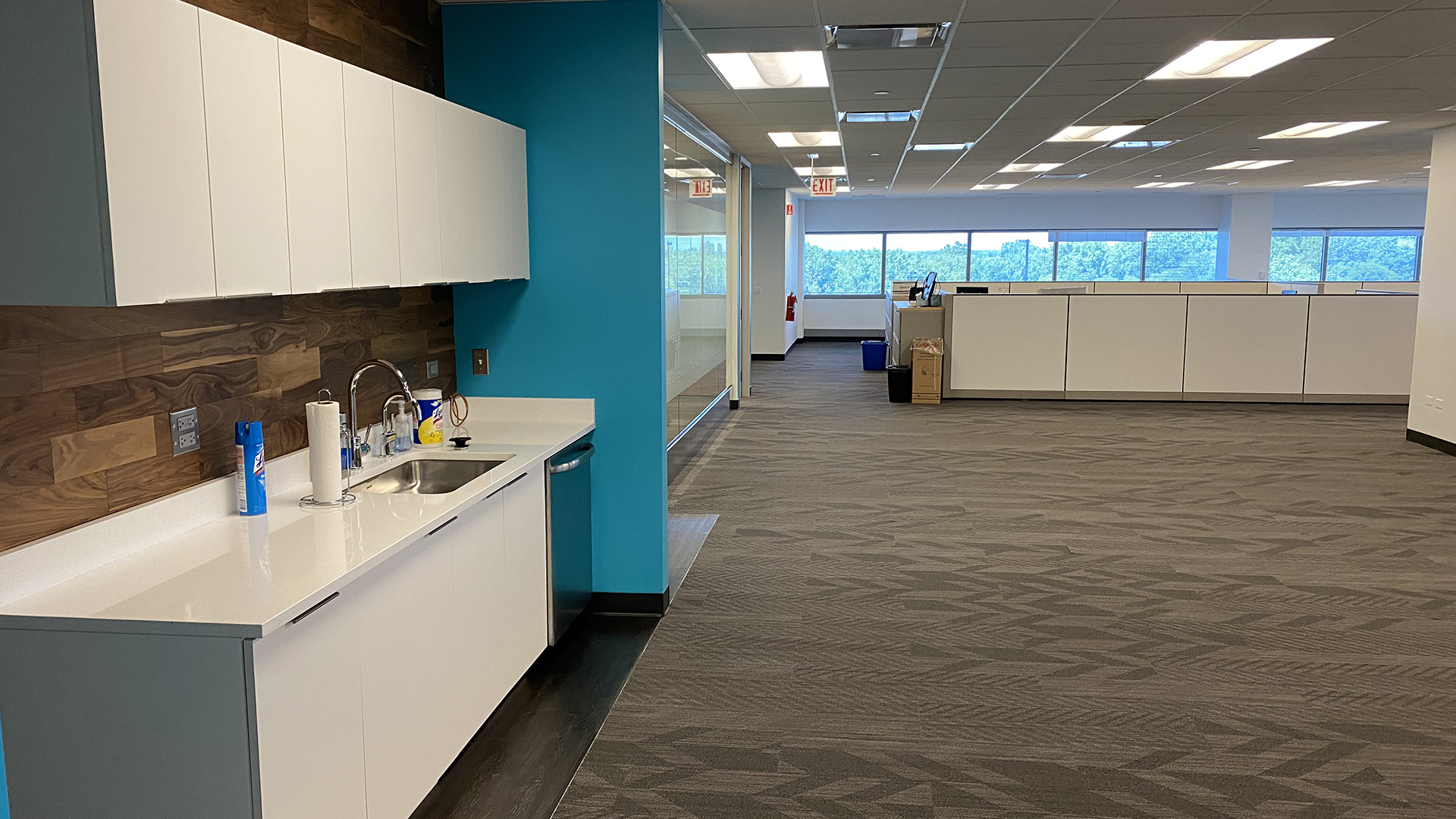 Kitchen and common area near cubicles in 200 N Martingale Ave