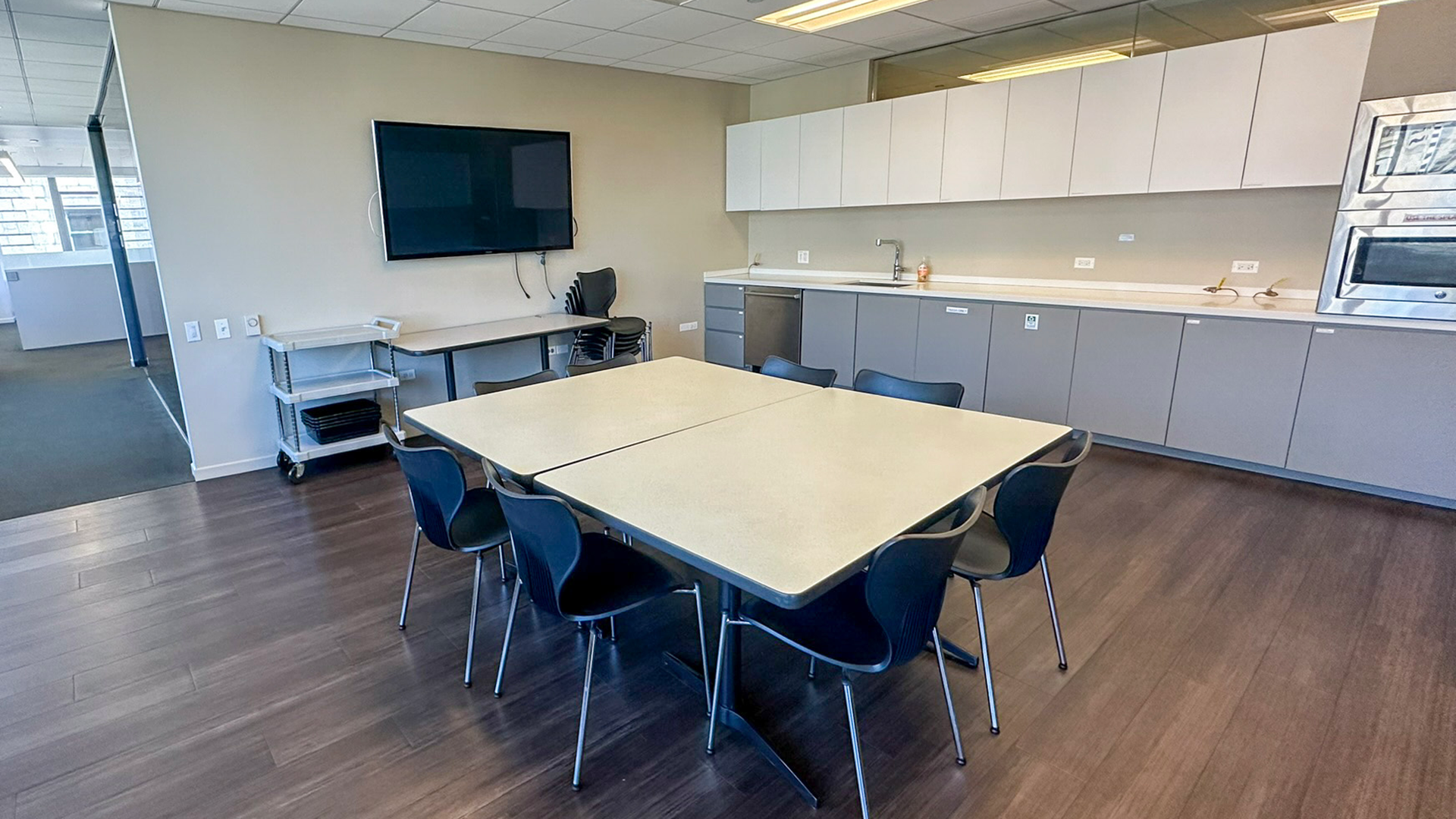 Kitchen area with table and TV