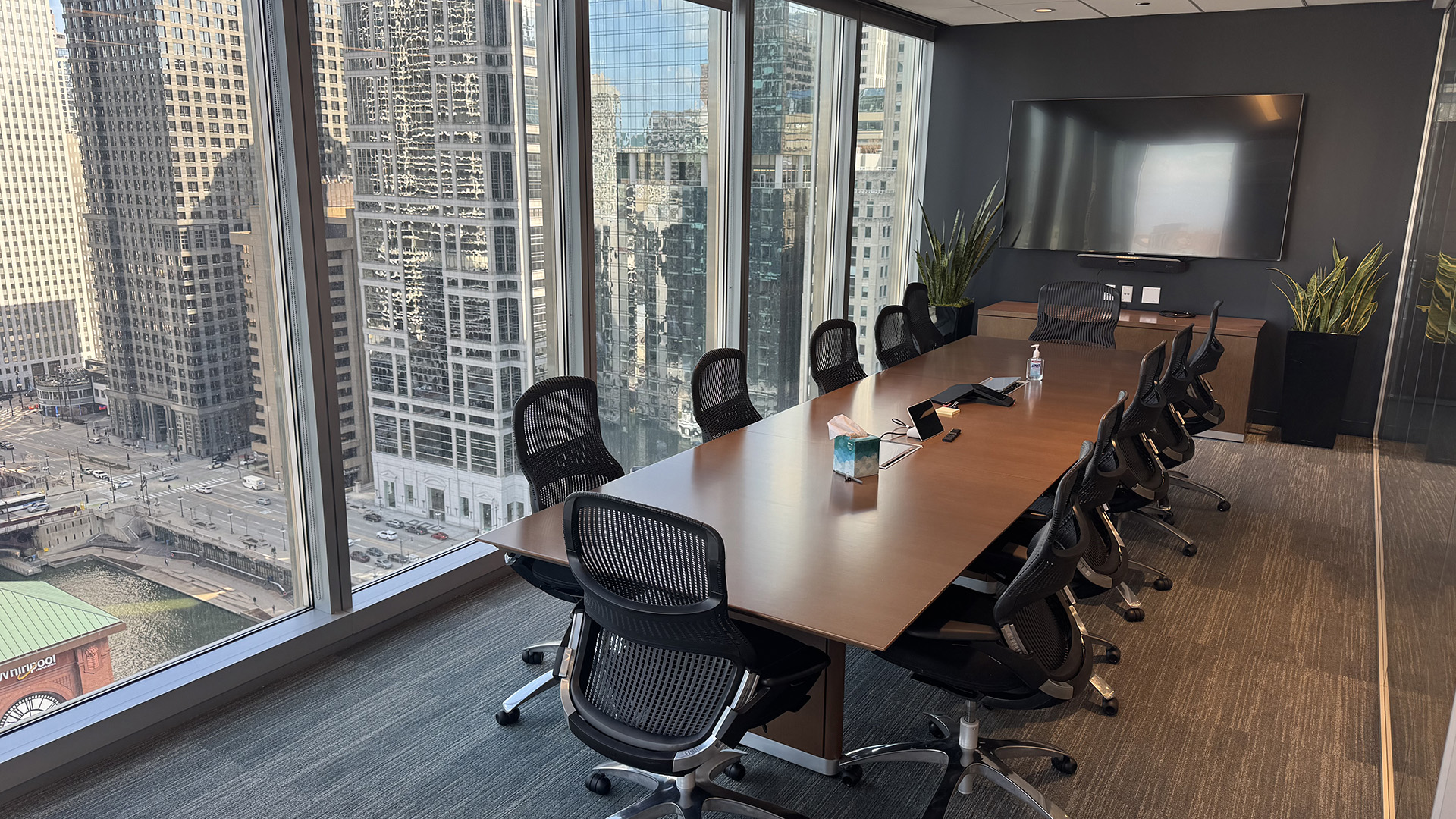 Conference room with conference table and chairs overlooking the city at 300 N LaSalle 