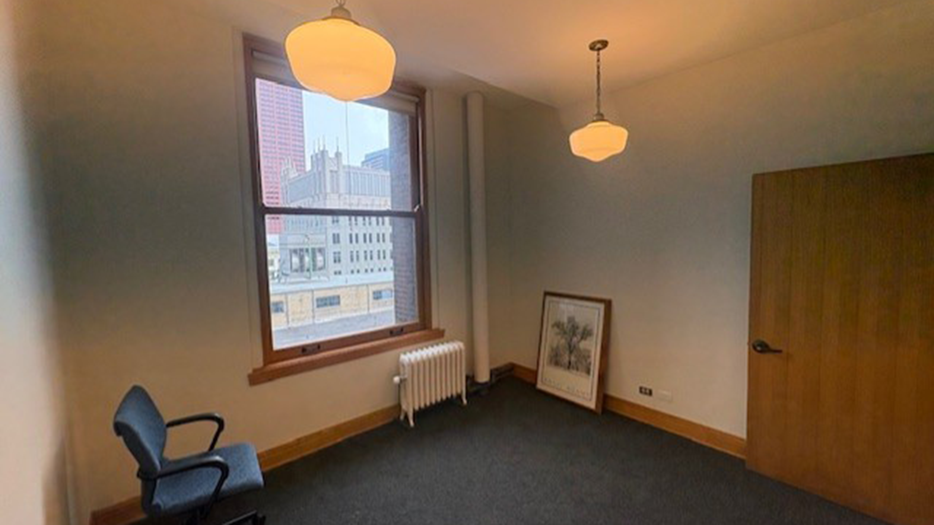 in side office room at 53 W Jackson with chair and window