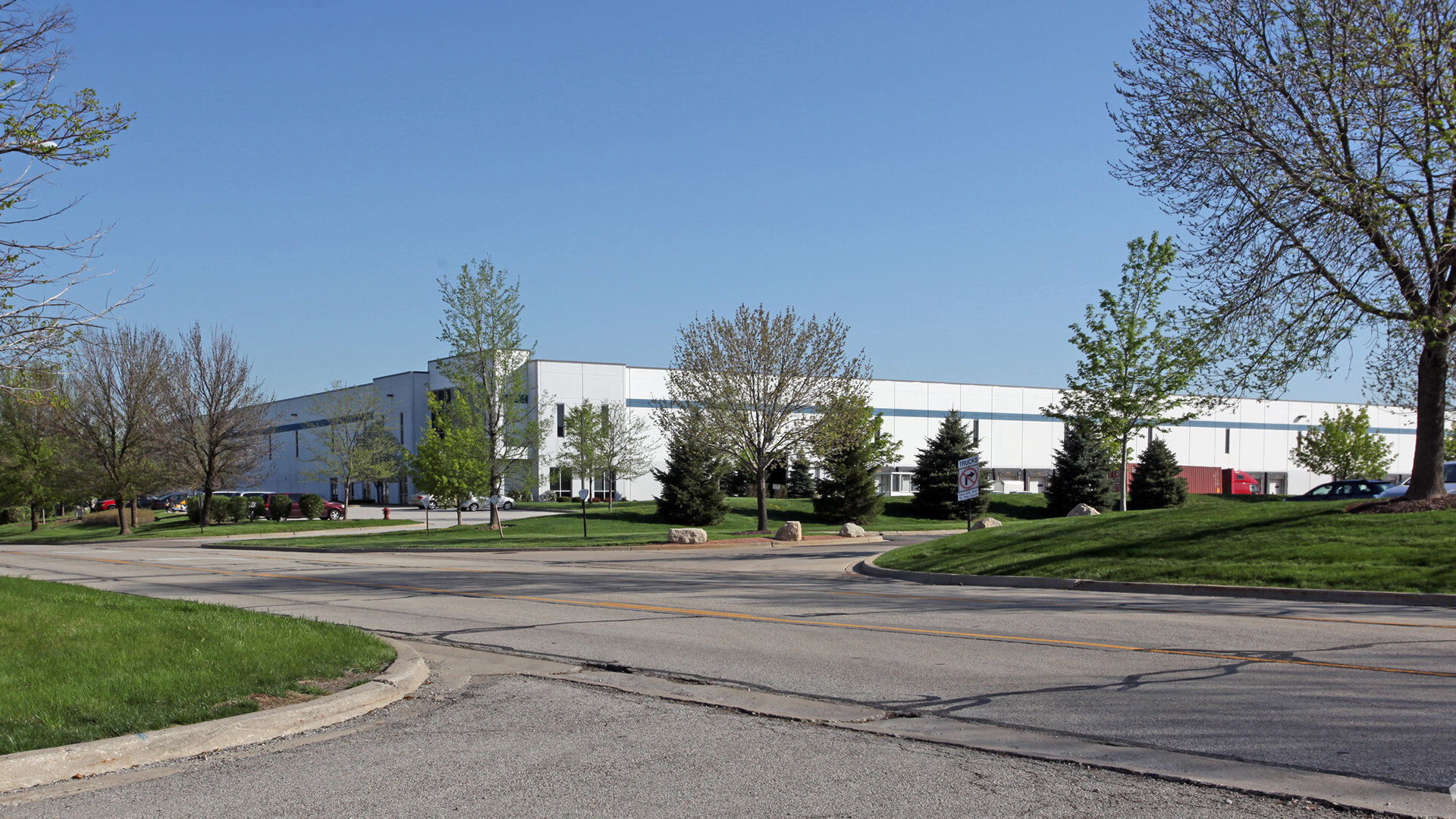 Exterior far away shot of 700 Gateway with trees visible
