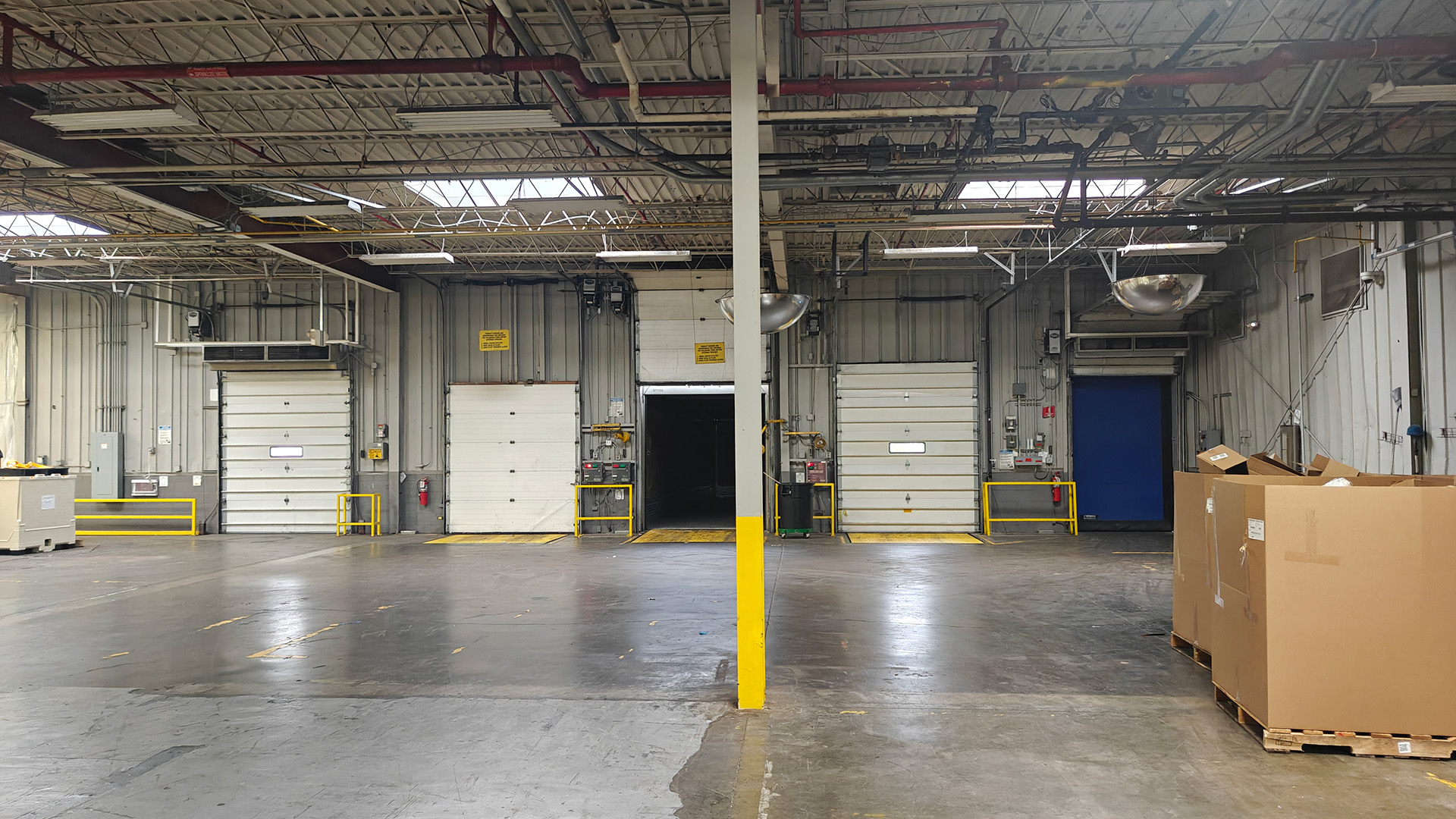 Inside of operating food production facility with loading dock doors