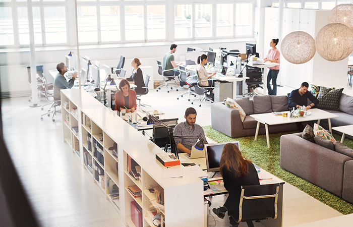People working at their desks in an open office
