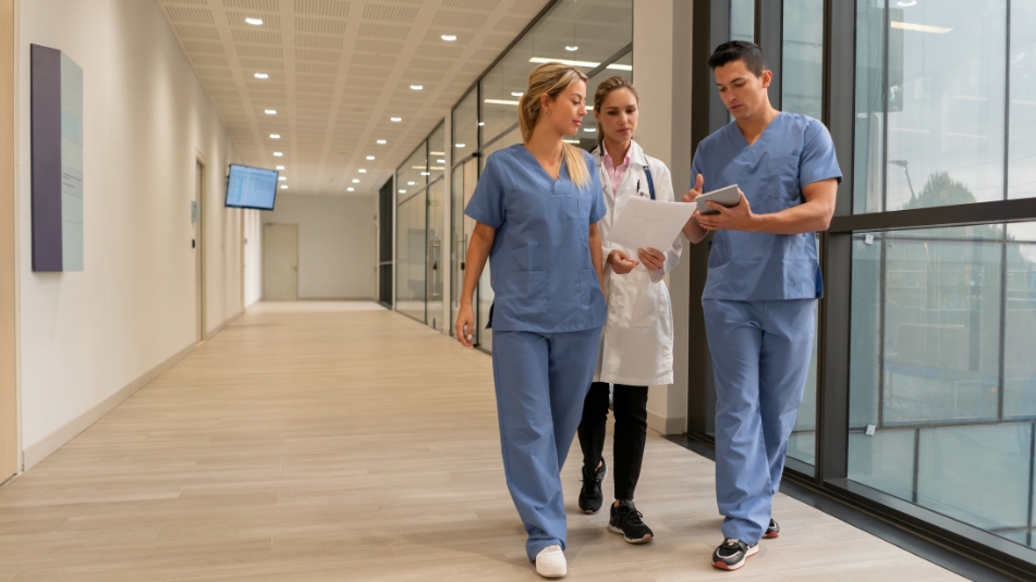 healthcare professionals walking down a hallway