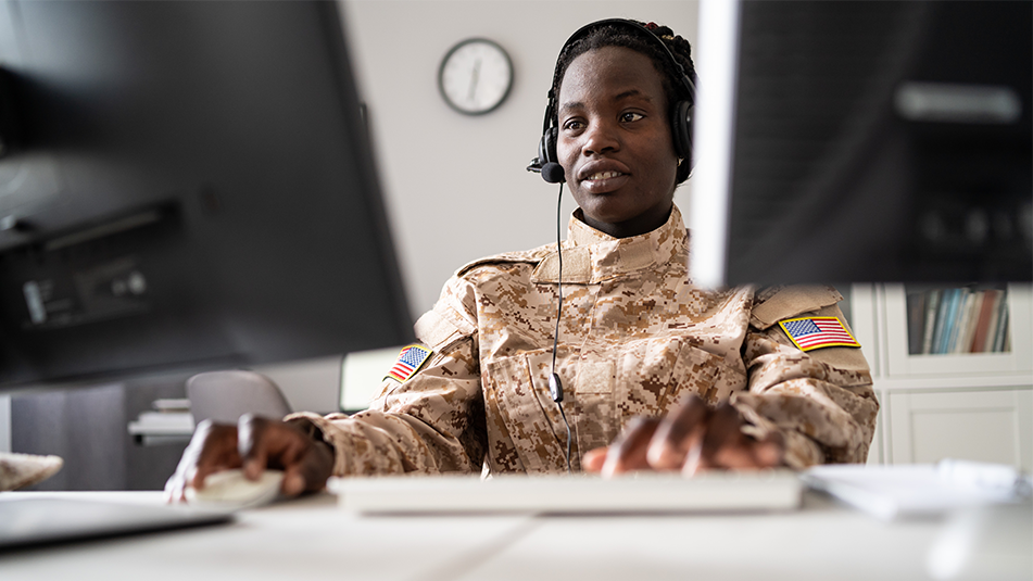 armed forces individual in front of a computer, technology