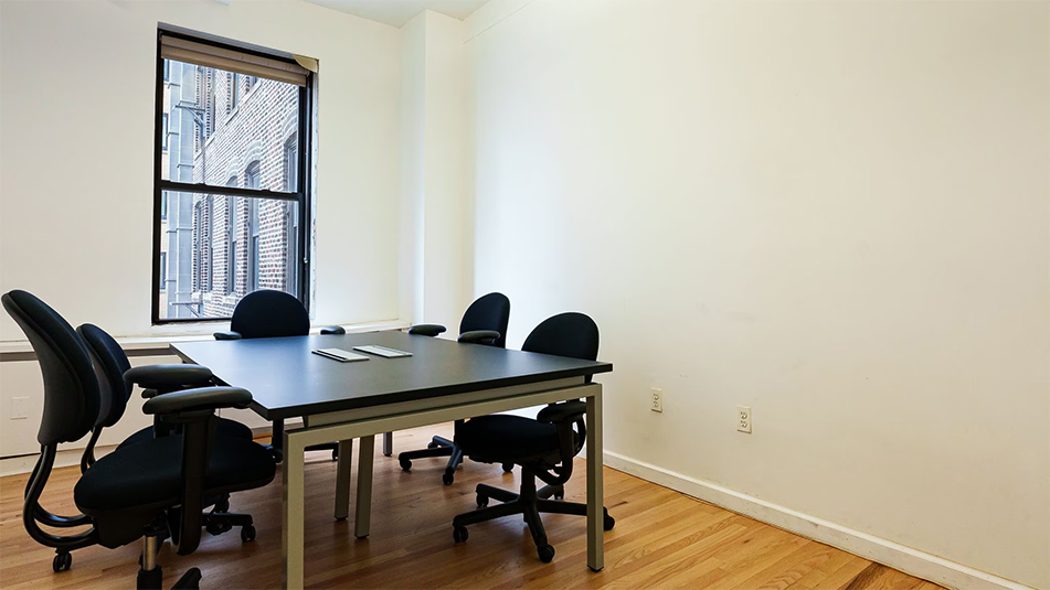 Conference room with table and four chairs