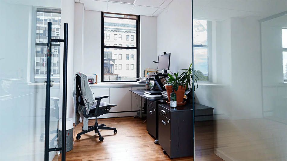 Looking into an office with a desk and chair