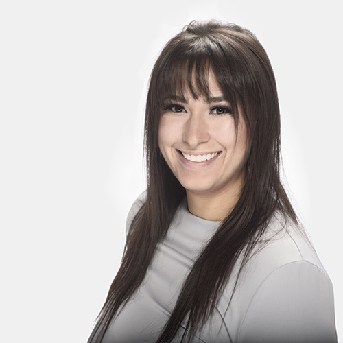 woman in blue shirt facing forward