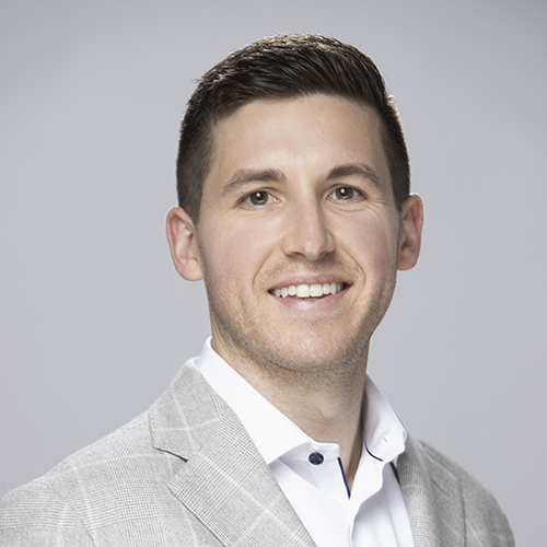 Man in gray jacket facing forward